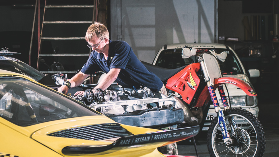 Mission Motorsport's Race team chief mechanic, Dave Wilkins, at work