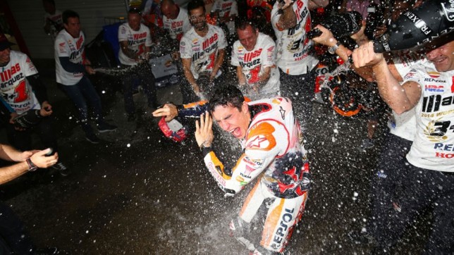 Marc Marquez celebrating his win with champagne in true racing style