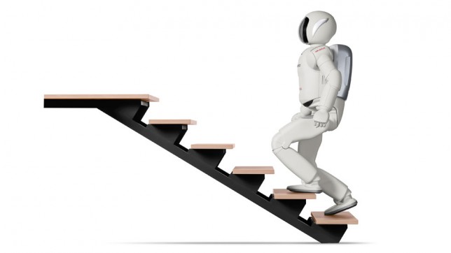 Honda's ASIMO robot walking up stairs Honda's ASIMO robot walking up stairs