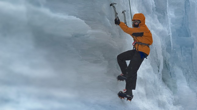 Person climbing in Antarctica Person climbing in Antarctica