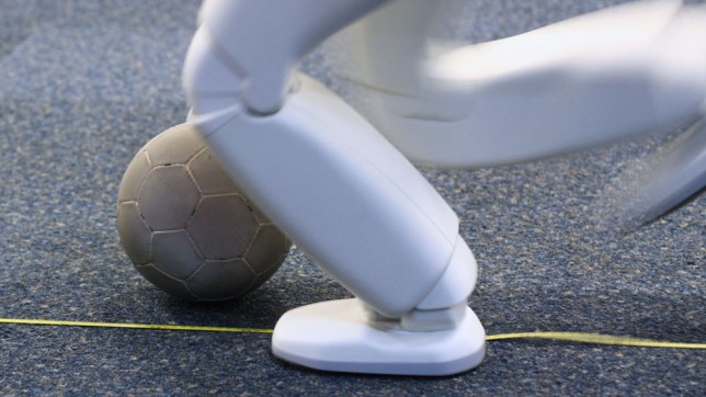 ASIMO football ASIMO kicking a football