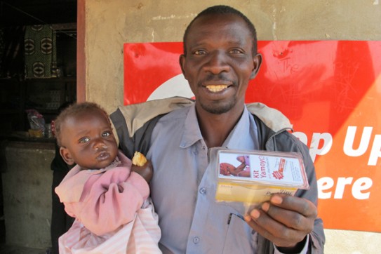 Cola Life Father with child and Kit Yamoyo | Siachitema